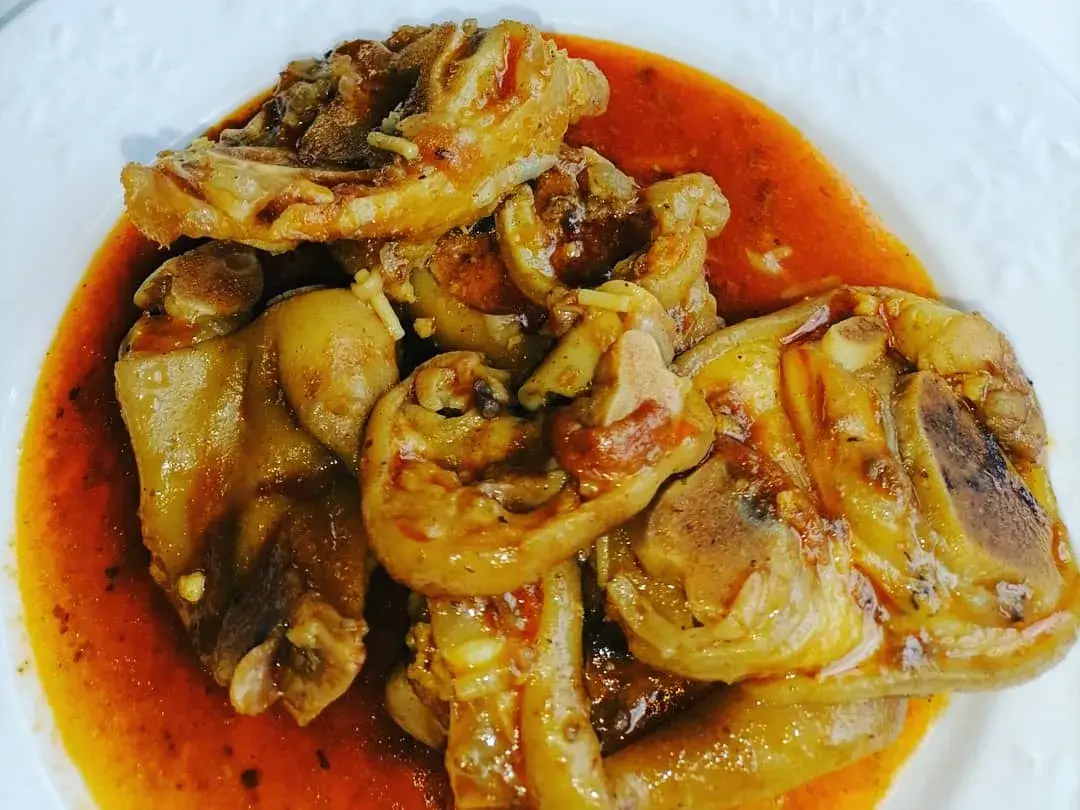 Pork trotters, a South African dish slow cooked until tender and served with pap